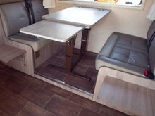 Some models have very narrow space between the seats and table. This one had plenty of legroom and additional extension for table and foldable seats