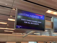 Early bag drop info screen at SIN