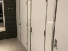 Bathroom has full private stalls. 