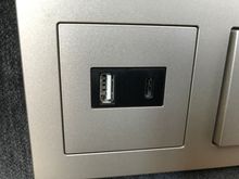 USB- charger on the bed's headboard
