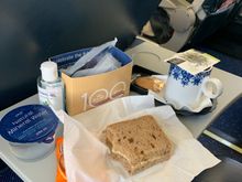 KLM intra-Europe J: box of water, cheese sandwich and a cookie. Also offered coffee or tea