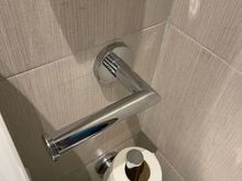 You have to bend your arm to reach the toilet paper