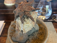 "Sea Sunstar" of Jiba (the starfish is made of fish and coated in edible sand covering a warm soup below it)