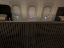 As you can see here, the walls are high enough that someone in the adjacent suite can't see in. They'd have to go into the aisle and then look down from there.