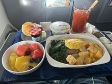 Breakfast frittata with spinach, potatoes, cheese sauce, fruit, warm and soft croissant with premium preserves(!) and the always present Chobani yogurt.
