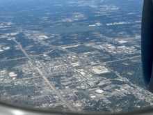 Jerry World, the current and former homes of the Texas Rangers, Six Flags over Texas, and more of the Metroplex visible as we turn for the downwind into DFW. 