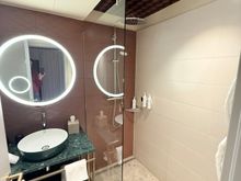 Rain shower with handheld. Bath products are from Molton Brown