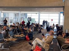 not especially busy waiting area - an empty flight approaches.
