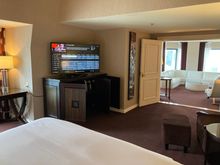 You can turn the TV to face the bed
