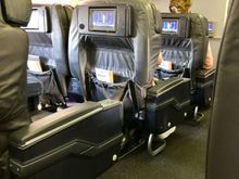 Tired and worn 737-800.  14 of 16 First class seats were occupied, 30 of the 150 Economy seats were.