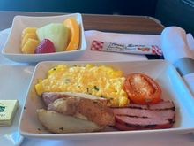 Scrambled eggs with bacon and potatoes. 