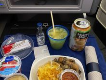 Breakfast on UA219 ORD-HNL 011/28/21:
Leek quiche with breakfast sausage, potatoes, tomato and tomato sauce, with assorted sides and a screwdriver