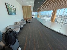 Main hall/walkway overlooking the tarmac and gate area below. Open and airy