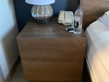 No easily accessible plug on either side of bed. You must pull the nightstand away from wall and use plug back there. 