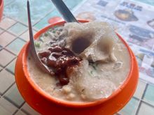 Cendol, a typical dessert of shaved ice, brown sugar, red beans and gelatine green worms.