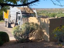 7 AM garbage truck out my bedroom window. 