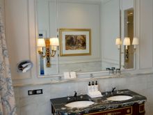 Spacious bathroom, unvisible is bath tub on the right followed by shower booth followed by toilet. 