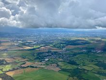 Just dipping under the cloud over Glasgow