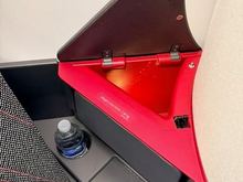 Storage areas, with wireless phone charging, which didn't work well with my phone.