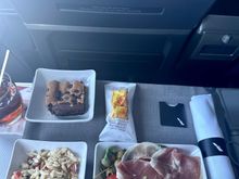 No predeparture drink because plane was late, 40 minutes in drinks started, 1 flight attendant for the entire first class, barely able to get the food served prior to landing.