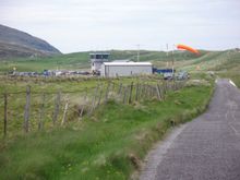 Terminal amongst the dunes - windsock indicates to stay off the beach as a plane needs it!