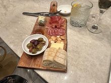 Meat and cheese board. Missing either more bread or crackers. 