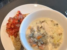 For anyone's curiosity, bruschetta and a creamy chicken and rice soup was served at the Alaska Lounge at JFK. The Alaska lounge had the other usual items minus the pancake machine. 