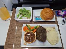 The beef was a bit chewy from being heated. No dessert was given but was offered. Not sure if there was any loaded or they ran out. Coffee was served before the dessert offer and then drink service was non existent. A snack basket was offered towards the end of the flight.