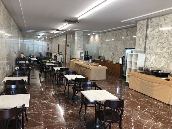 Main lounge dining area. There is further seating behind the partition at rear. 