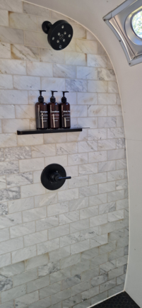 The shower was surprisingly spacious and very comfortable. Aside from needing to be mindful of water usage, it really felt like staying in a first-class hotel. I didn’t try the AutoCamp-branded toiletries (except for the hand soap).