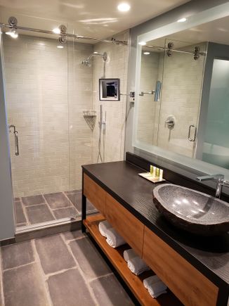 Master bath includes walk-in shower and free standing tub. Nice finishes here along with Hilton branded towels. 