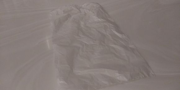 They provide you a plastic bag to temporarily store your mask while eating.