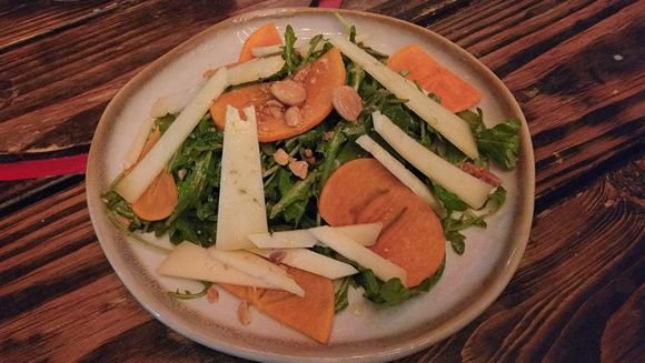 Arugula and Manchego Salad with Persimmon. Marcona Almond and Quince Dressing