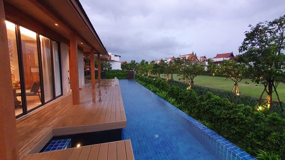 The longer of the two pools looking towards the resort