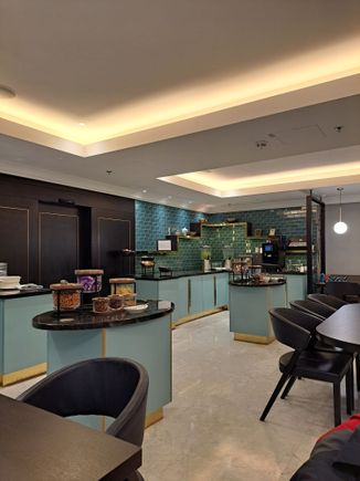Afternoon snack selection in the lounge  ( chocolate, nuts, pretzels, crisps)