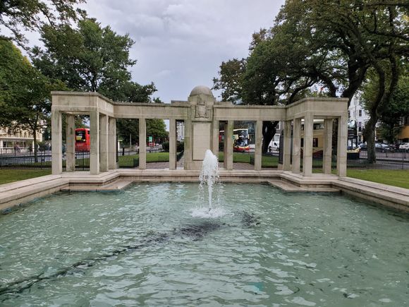 A fountain with a nice sculpture behind