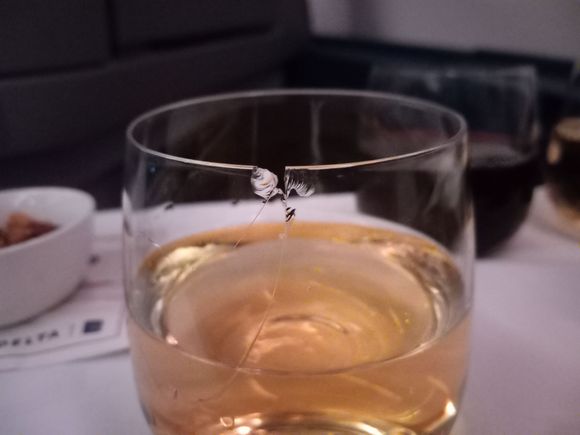 While I'm partial to S&M, I wasn't expecting it on this flight. FA apologized and replaced it (fresh pour, obviously), but did not replace the table cloth which was wet as the glass was leaking actually. I survived. 