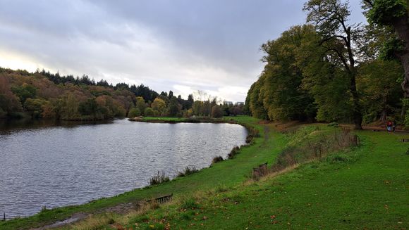 Callendar Park lake. Tarmac path to right ( with solar lights imbedded in the path so provides some light at night ) with a rougher path to left of lake. .When I was younger they had a rowing boat rental place on the lake but it has long gone