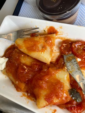 The pasta is rather large to be practical to eat in the confines of a short haul Airbus 😂 Rather a lot of tomato sauce too. Great big dollops of goats cheese. Death by cheese again on the tray, along with the cheese side … 