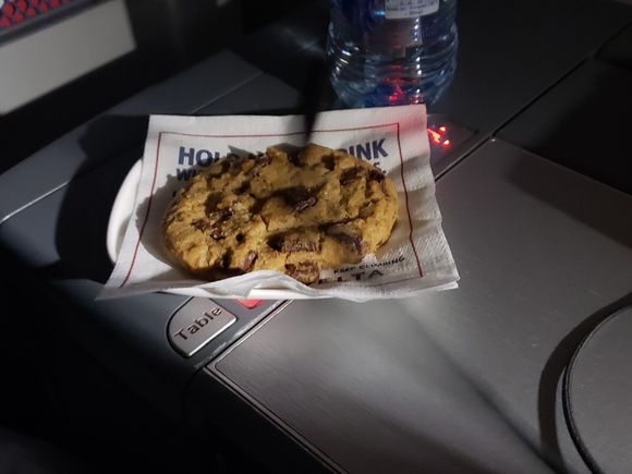 Warm Chocolate Chip Cookie mid-flight, milk came a moment after upon request :)
