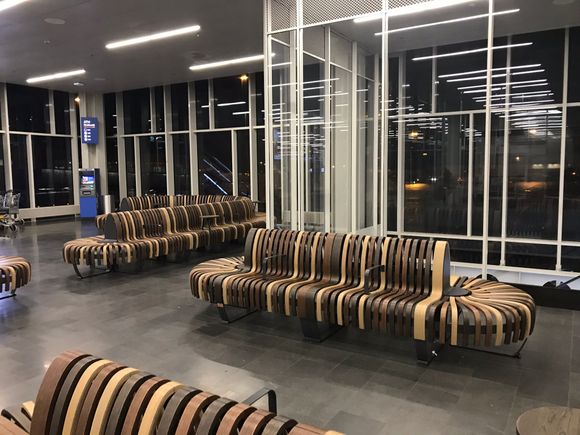 Very stylish seating by the gate.