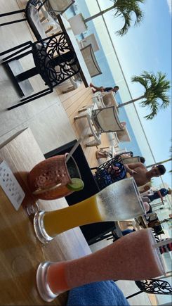 Forgetting about the robbery already... Fresh mango and strawberry juice with moscow mule.
