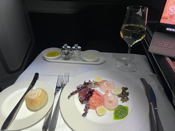 Smoked salmon tartare with poached  shrimp, quail egg, capers, rocket pesto