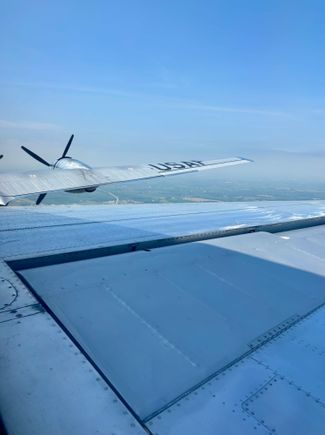 View forward over the starboard tail plane and wing from the rear turret.