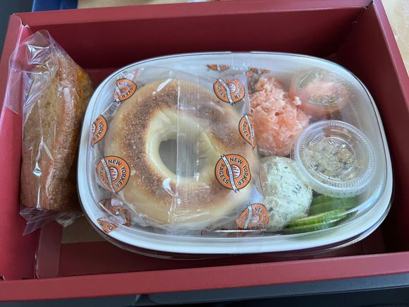 Smoked salmon mini bagel … the size of four coffee creamers.