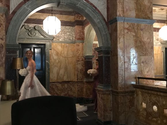 The blushing bride in the upper corridor