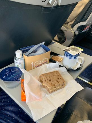 KLM intra-Europe J: box of water, cheese sandwich and a cookie. Also offered coffee or tea