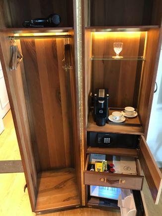 Signature trunk functions as wardrobe:
- Hairdryer
- Coffeemachine
- Safe
- Minibar (empty)