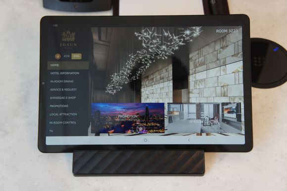 Tablet next to the phone for ordering services.