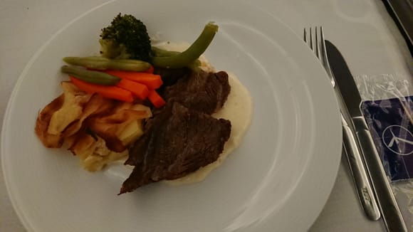Main course: Beef cheeks with horseradish sauce served with potato gratin and vegetables 